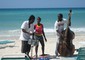 Viaggi di Pasqua - musicisti sulla spiaggia di Negril, in Giamaica © Ansa