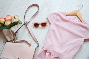 Fashionable concept, pink style. Dress, bag and glasses. View from above  iStock. (ANSA)
