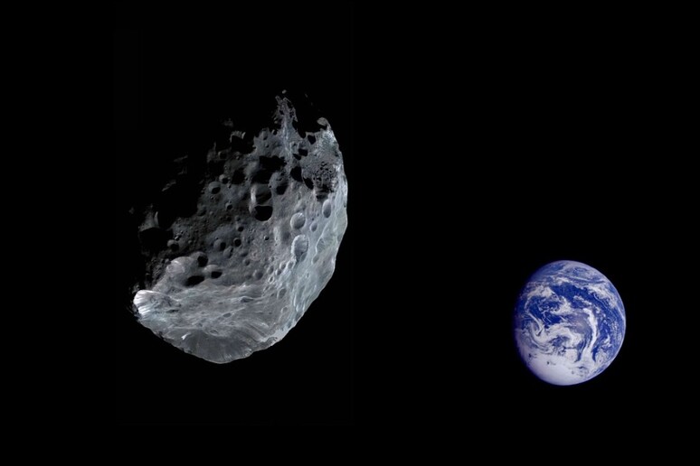 Rappresentazione artistica del passaggio ravvicinato di un asteroide alla Terra (fonte: Piaxabay) - RIPRODUZIONE RISERVATA