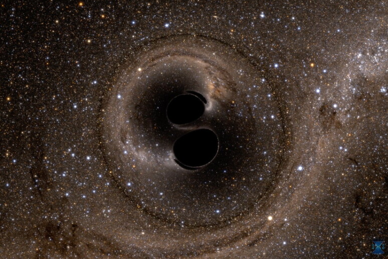Rappresentazione artistica della fusione di due buchi neri  (fonte: imulating eXtreme Spacetimes, SXS, project. Courtesy of LIGO) - RIPRODUZIONE RISERVATA